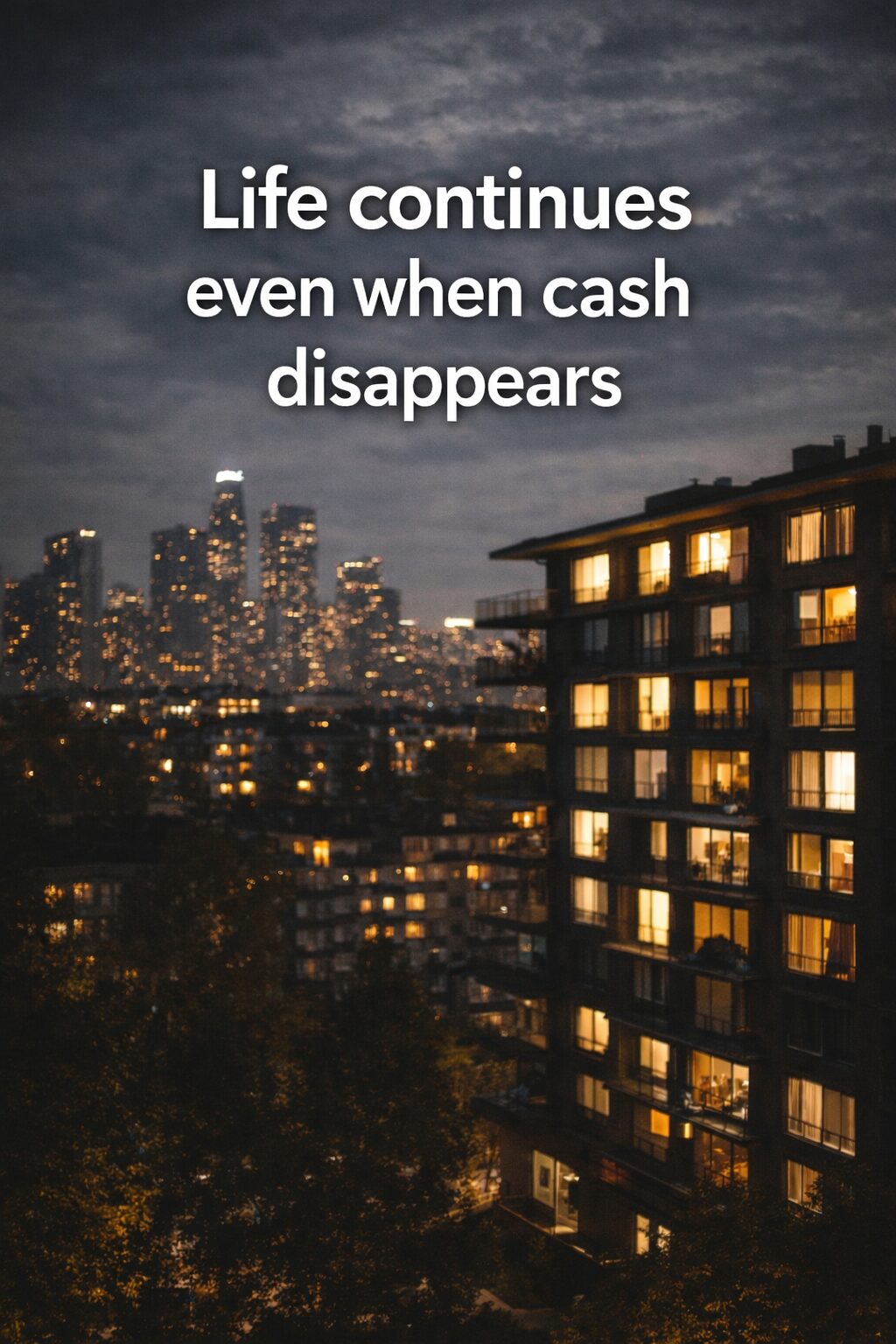 City apartment buildings at night with window lights showing that life continues even when cash flow stops